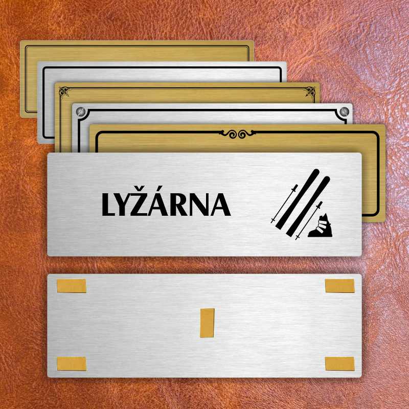 Lyžárna, 240x79mm, zlatá popiska s ozdobou uprostřed