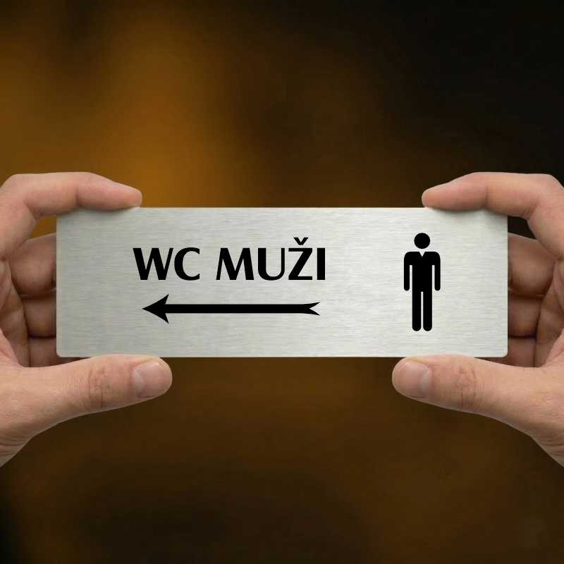WC muži vlevo, 200x66mm, stříbrná popiska s ozdobou uprostřed