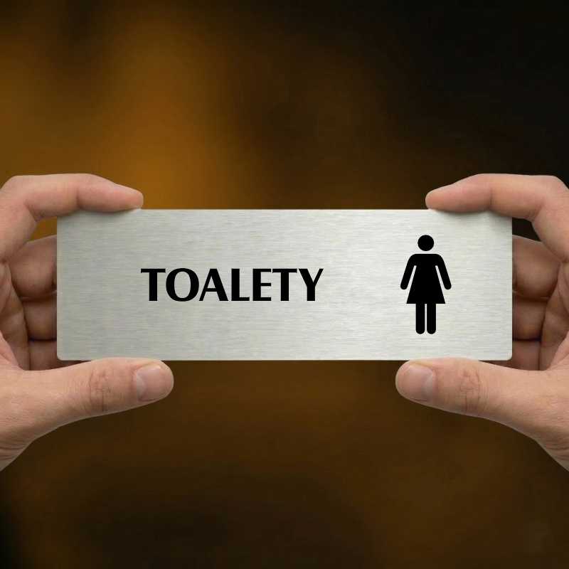 Toalety ženy, 200x66mm, zlatá popiska s imitacemi šroubků