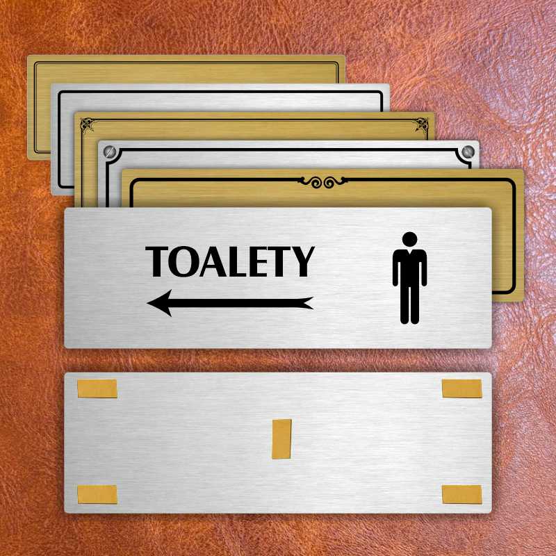 Toalety vlevo muži, 200x66mm, zlatá popiska s okrasným rámečkem  