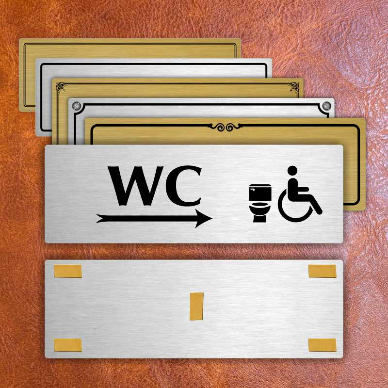 WC invalida vpravo, 240x79mm, stříbrná popiska s ozdobou uprostřed