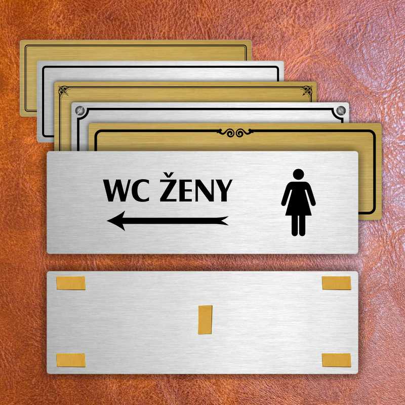 WC ženy vlevo, 200x66mm, zlatá popiska s ozdobou uprostřed