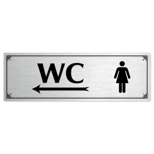 WC ženy vlevo, 240x79mm, stříbrná popiska s okrasným rámečkem  