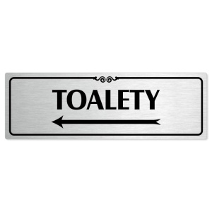 Toalety vlevo, 240x79mm, stříbrná popiska s ozdobou uprostřed
